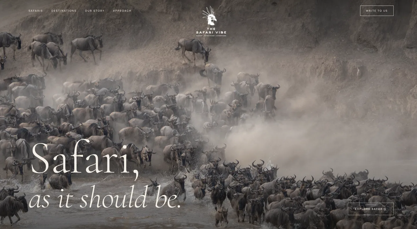 The Safari Vibe’s own website: a herd of wildebeest crossing a river under the words “Safari, as it should be”